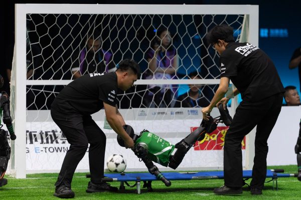 Two robots stretchered off in world’s first AI football match